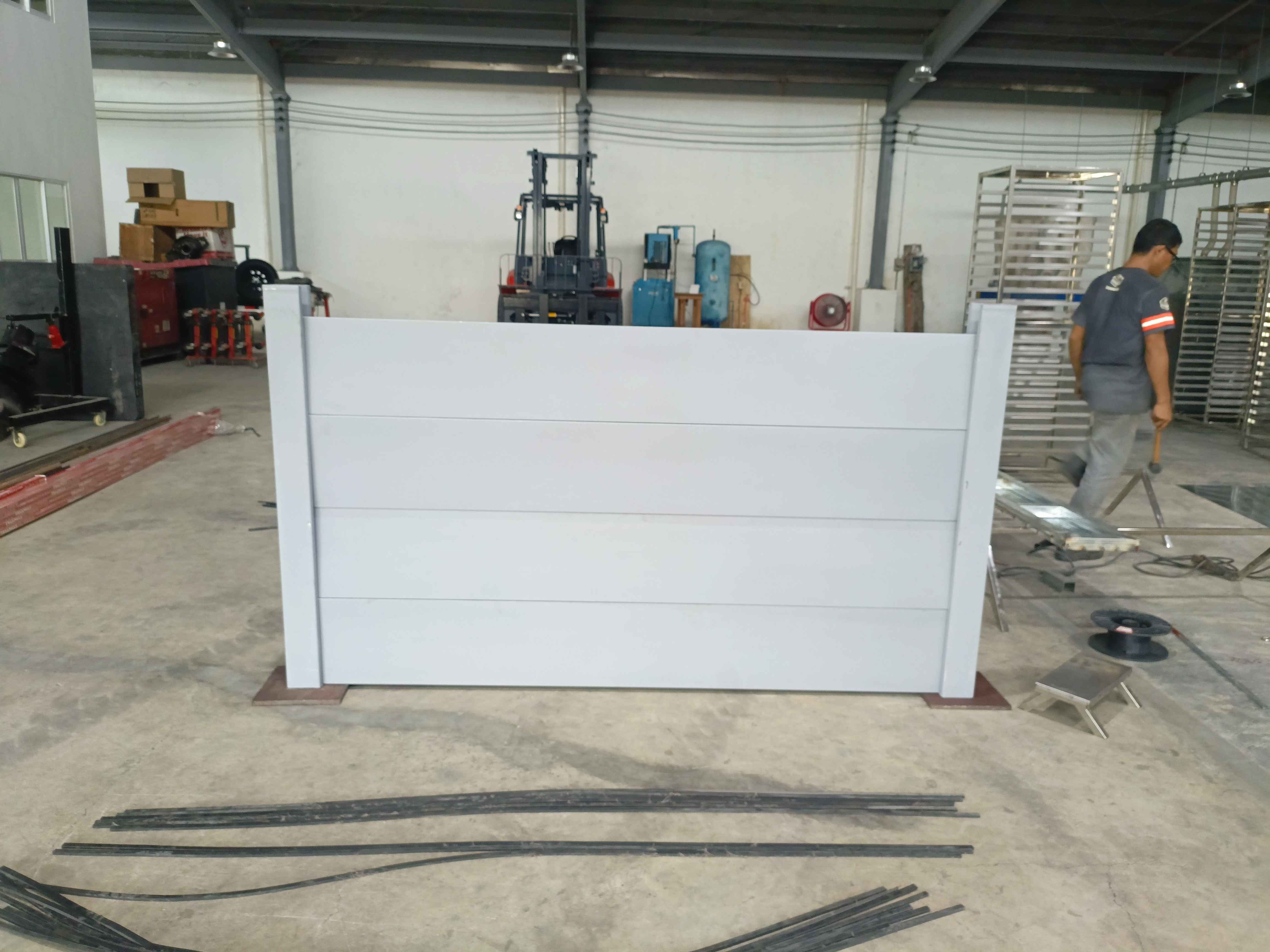 Architectural metal gate detail with strong fabrication lines