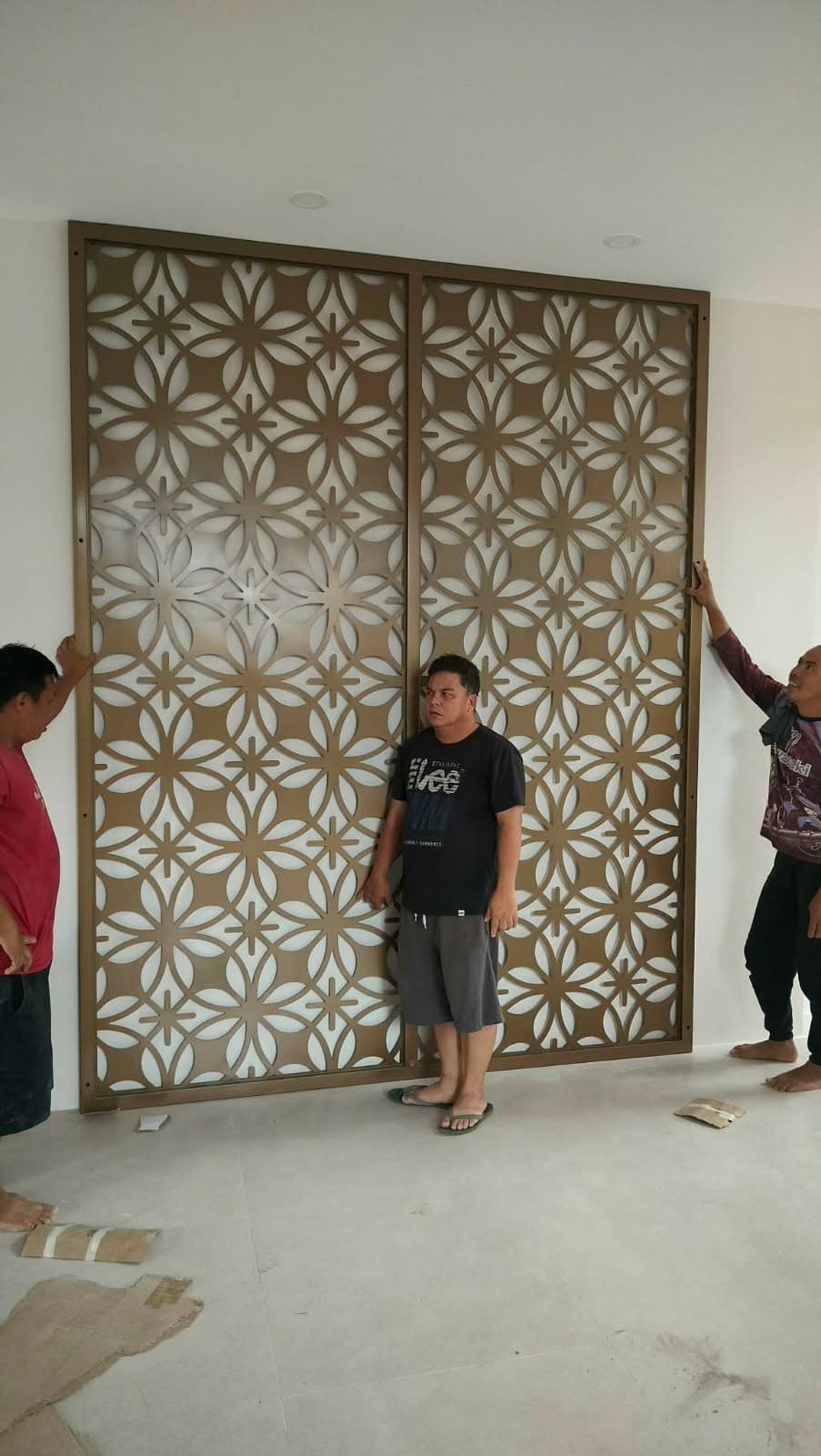 Installed decorative steel screen panel showing real-world scale