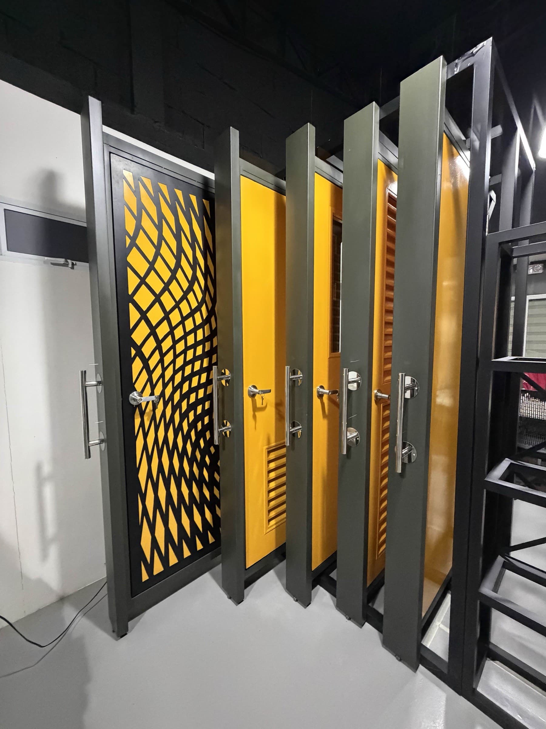 Showroom-style steel doors with bold color accents and patterned detail