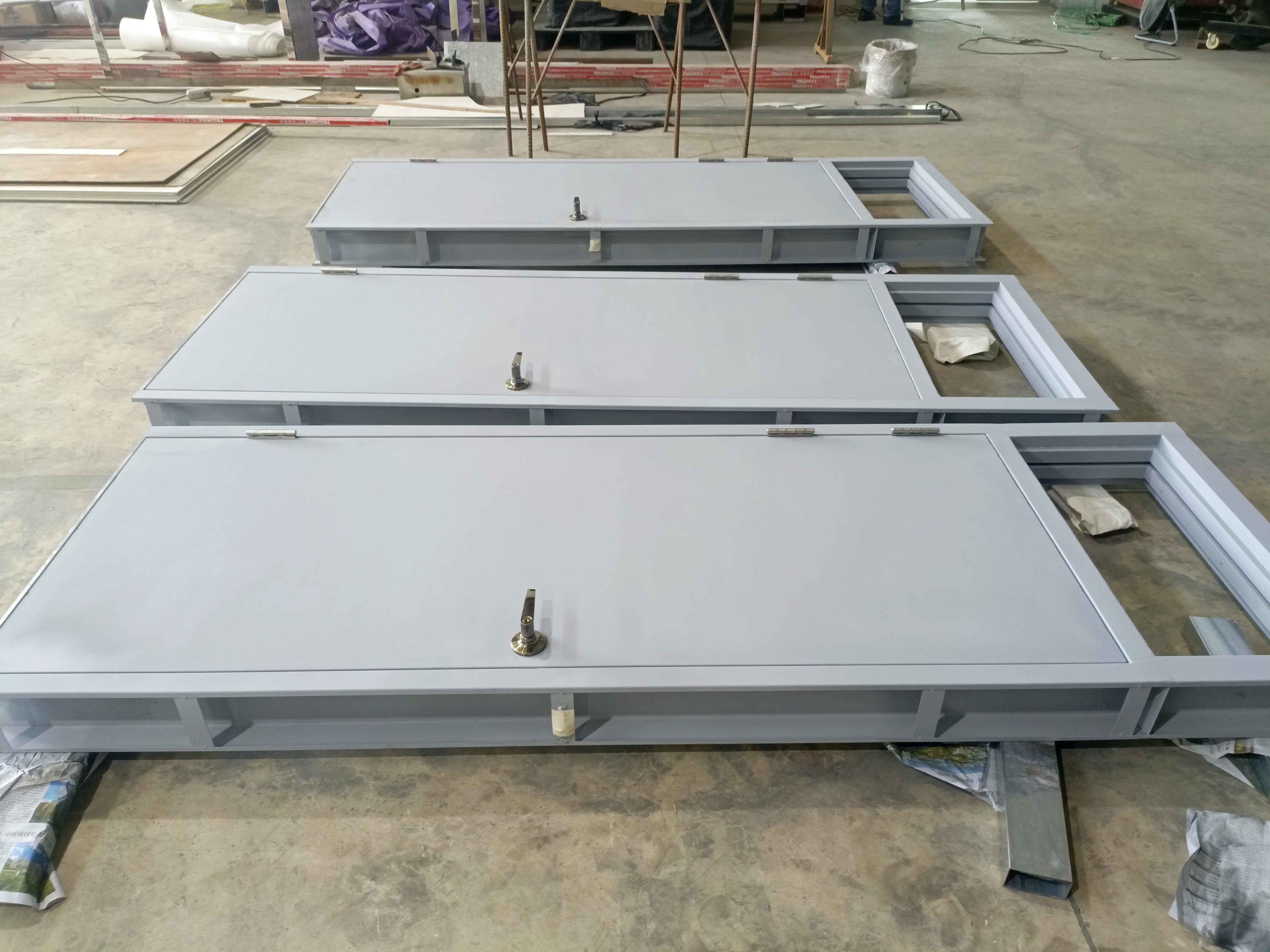 Steel door fabrication with bold finish and hardware detail